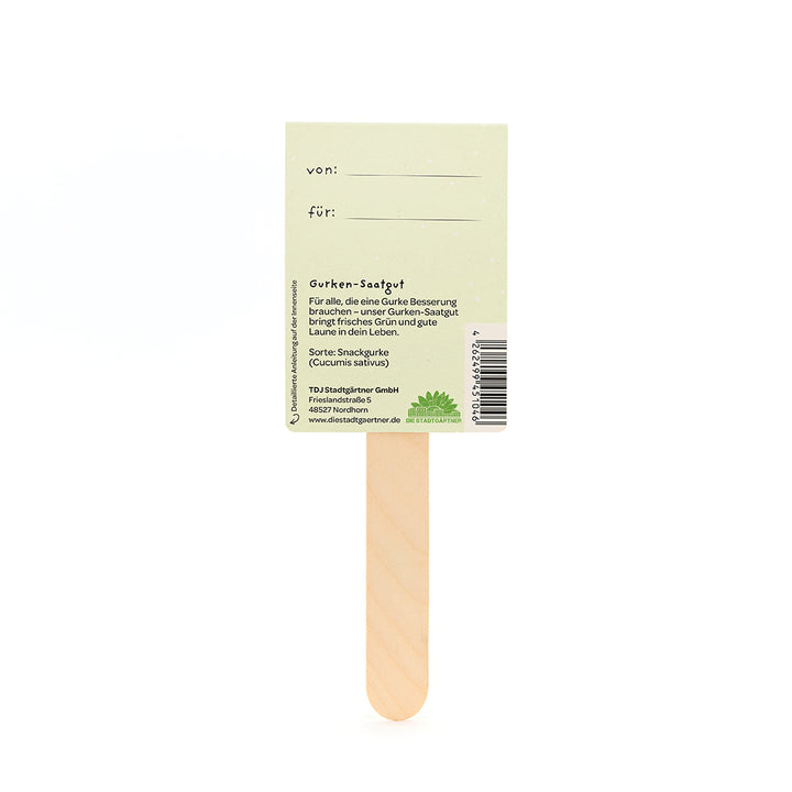 Rückseite eines Gurken-Saatgut-Sticks aus Holz mit Beschriftungsfeld "von" und "für" sowie Produktinformationen.